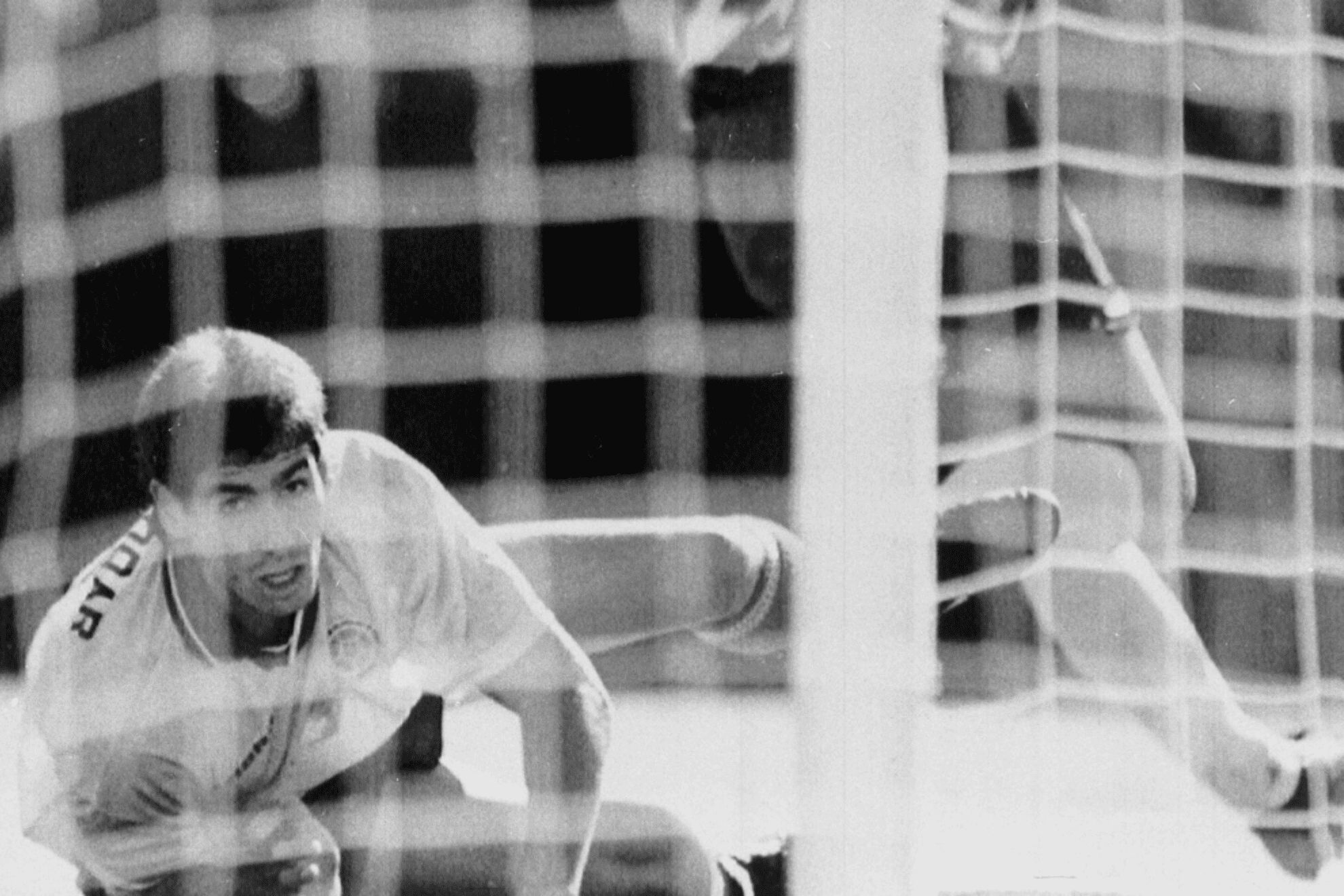 Colombias Andres Escobar lies on the ground and watches a shot by Americas Eric Wynalda miss the Colombian goal during a World Cup match at the Rose Bowl in Pasadena, Calif., June 22, 1994.